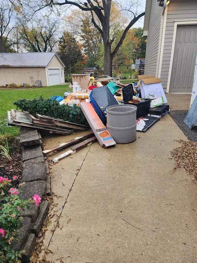 Dumpster being loaded with debris for 3 Yard Dumpster Rental in Waupun